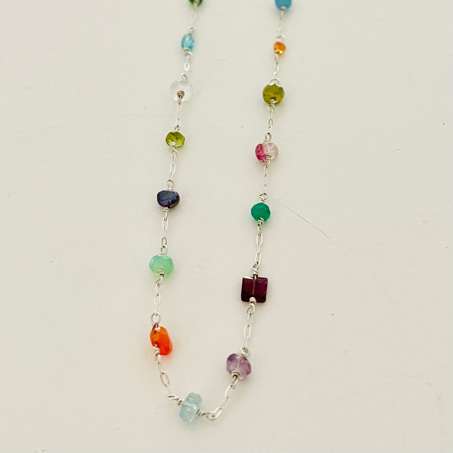 Long asymmetrical gemstone necklace